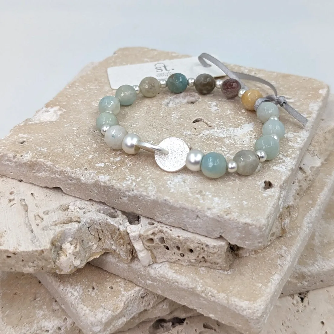 Facetted amazonite stretchy beaded bracelet with textured link disc component